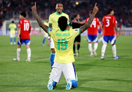 Igor Jesus celebrates scoring Brazil's first goal against Chile