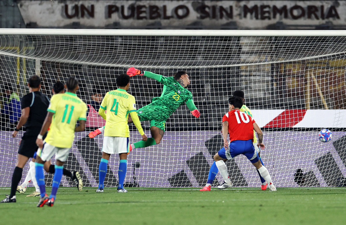 Chile's Eduardo Vargas scores their first goal past Brazil goalkeeper Ederson