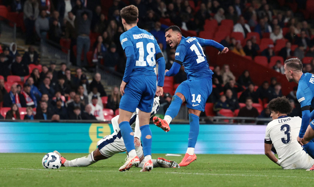 Vangelis Pavlidis scores Greece's second goal past England goalkeeper Jordan Pickford