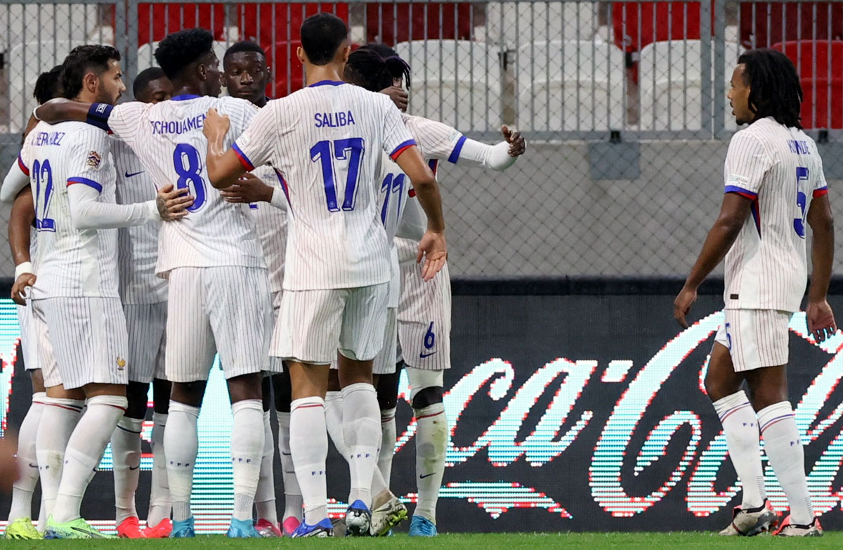 France's players celebrate after Christopher Nkunku scored the second goal against Israel