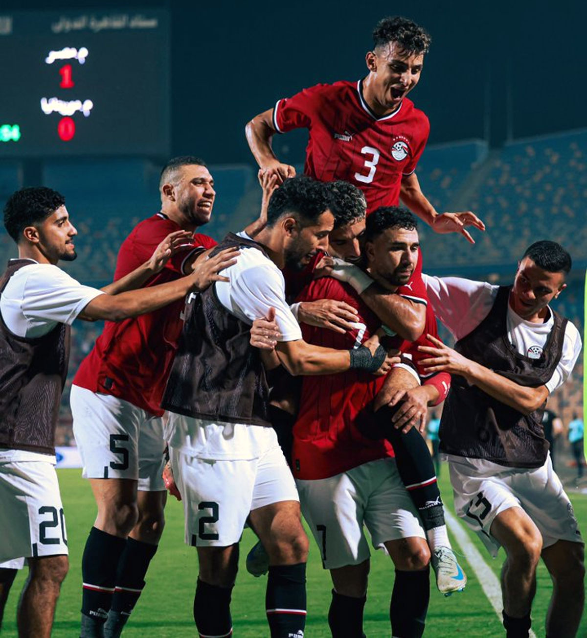 Egypt's players celebrate winning their Africa Cup of Nations match against Mauritania