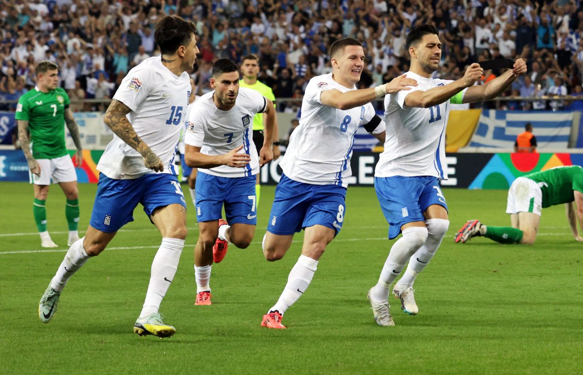 Anastasios Bakasetas celebrates scoring Greece's first goal