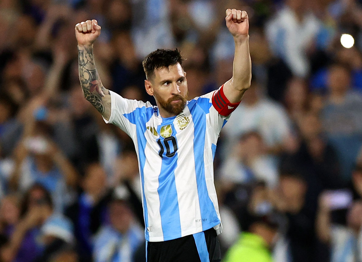 Lionel Messi celebrates after completing his hat-trick