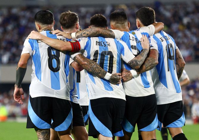 Lionel Messi celebrates with teammates after scoring Argentina's fifth goal.