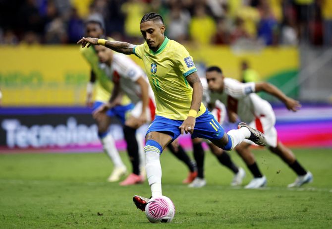 Raphinha scores Brazil's first goal from the penalty spot