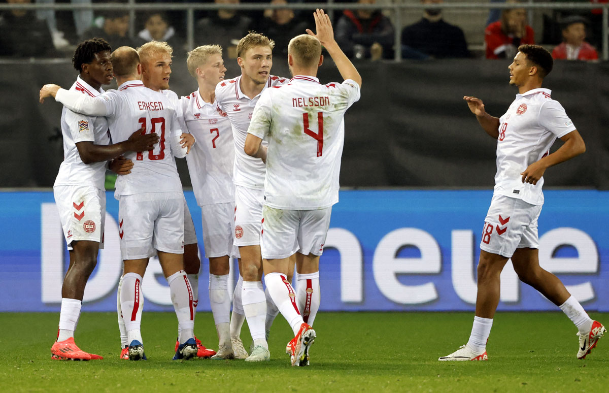 Denmark's players celebrate after Gustav Isaksen scored the first goal against Switzerland