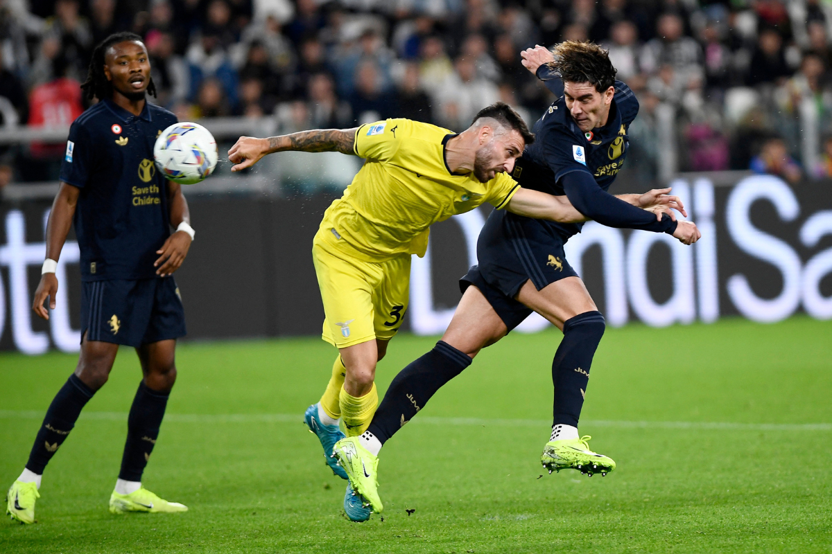 Lazio's Mario Gila in action with Juventus' Dusan Vlahovic during their Serie A match at Allianz Stadium, Turin, Italy 