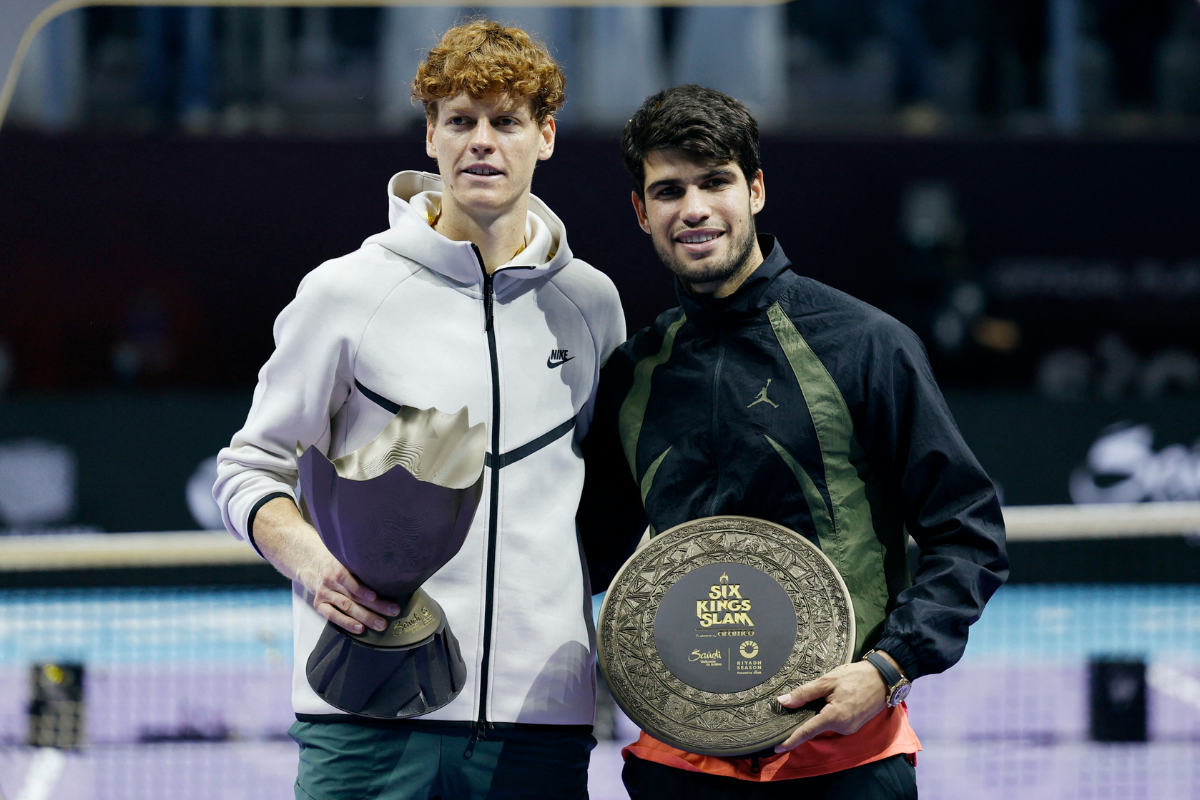 Italy's Jannik Sinner poses with the trophy alongside Spain's Carlos Alcaraz after winning the 6 Kings Slam final in Riyadh, Saudi Arabia, on Saturday