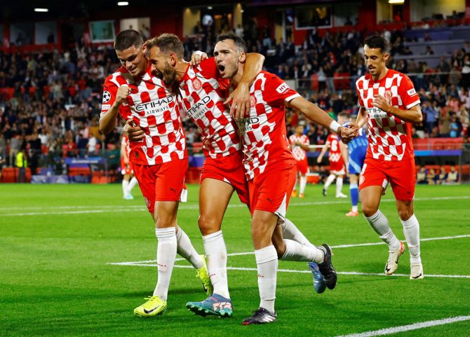 Miguel Gutierrez celebrates with teammates after scoring Girona's first goal