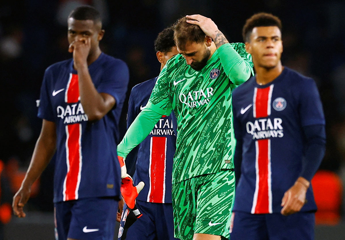 The dejected Paris St Germain's players after drawing their match against PSV Eindhoven