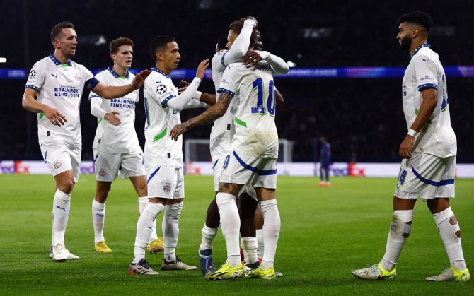 Noa Lang celebrates scoring PSV Eindhoven's first goal with teammates