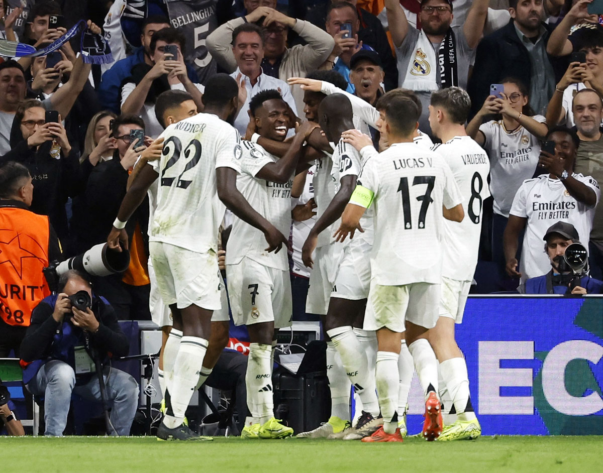 Vinicius Junior celebrates with teammates after scoring Real Madrid's fifth goal