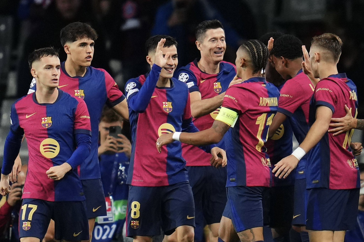 FC Barcelona players celebrate with Raphina after his hat-trick against Bayern Munich at Estadi Olimpic Lluis Companys, Barcelona, Spain