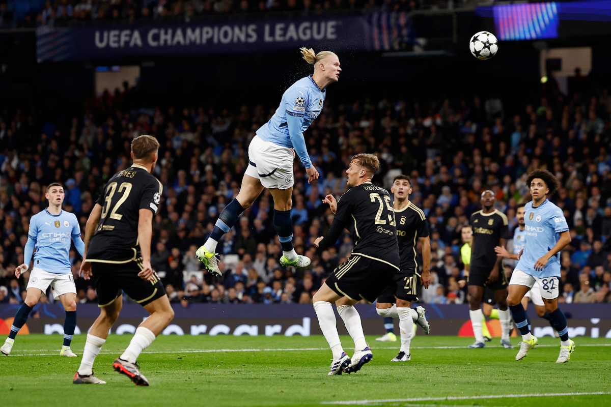 Manchester City's Erling Haaland is airbound as he heads in a spectacular goal against Sparta Prague at Etihad Stadium, Manchester, 