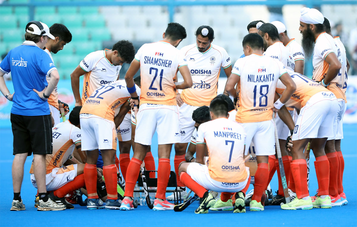 India's players discuss strategy during a break in the second hockey Test against Germany on New Delhi on Thursday