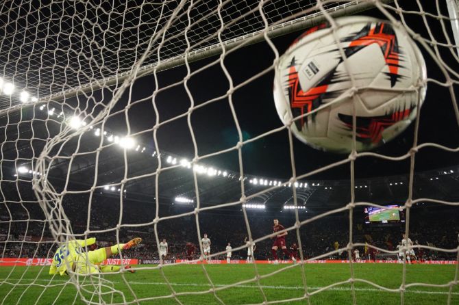 AS Roma's Artem Dovbyk scores their first goal from the penalty spot 