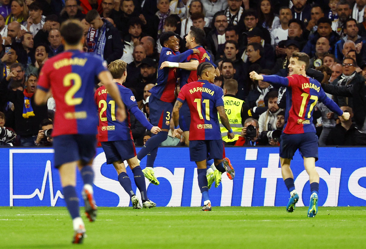 Barcelona's players celebrate after Robert Lewandowski scored the second goal