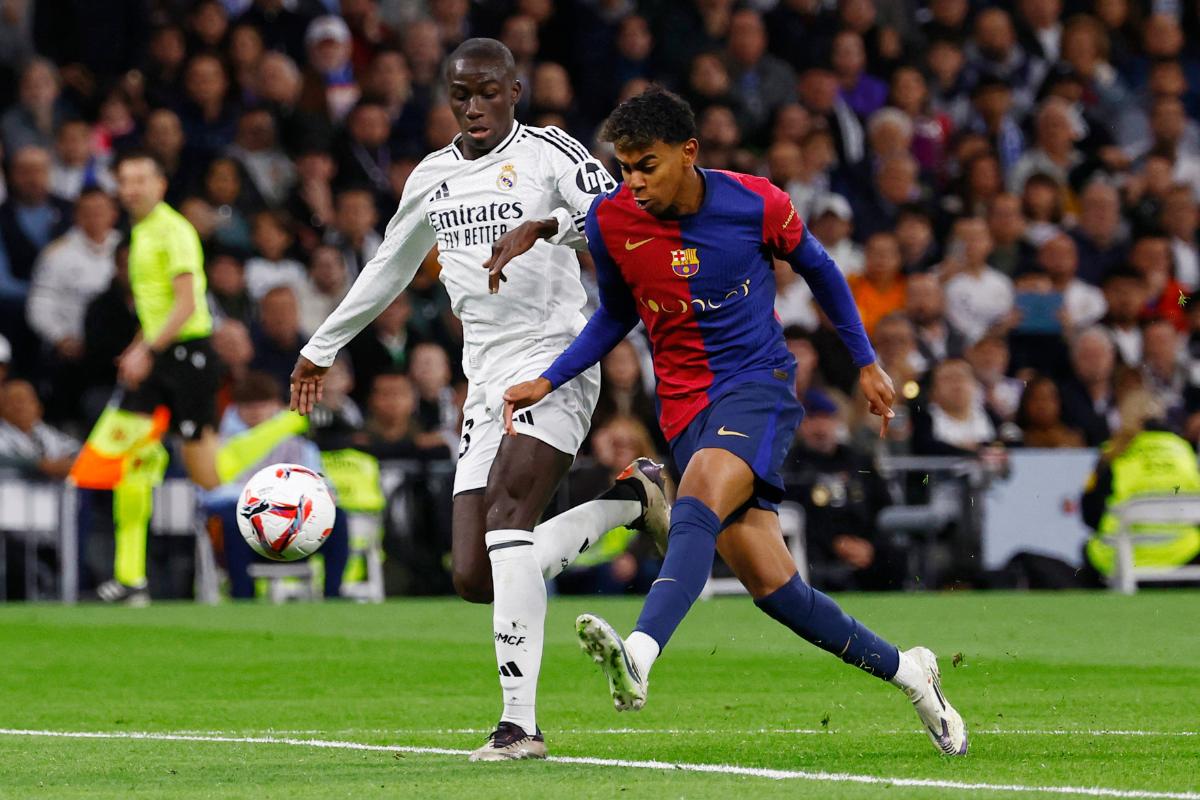 Barcelona's Lamine Yamal (right) was subject to racist abuse during the El Classico against Real Madrid at the Santiago Bernabeu on Saturday