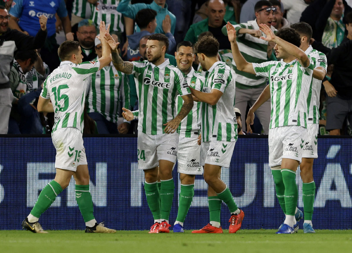 Real Betis' players celebrate a goal