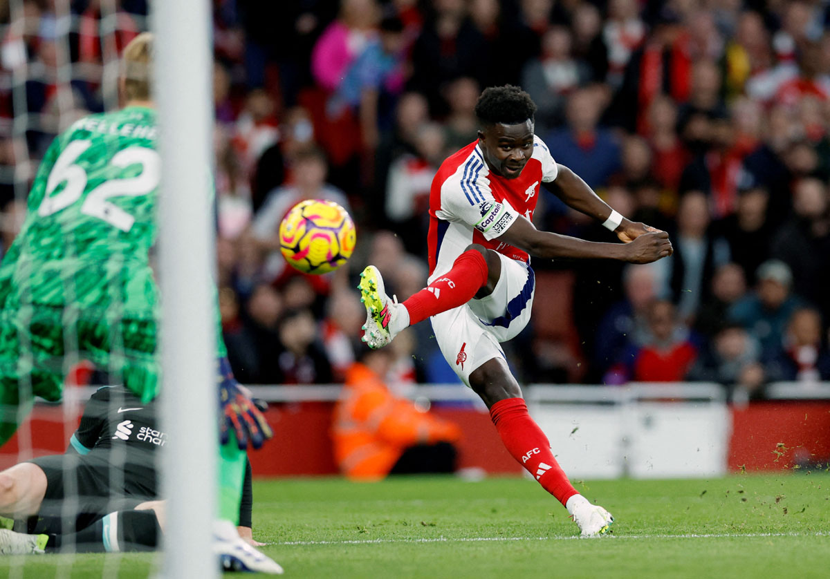 Arsenal's Bukayo Saka scores their first goal