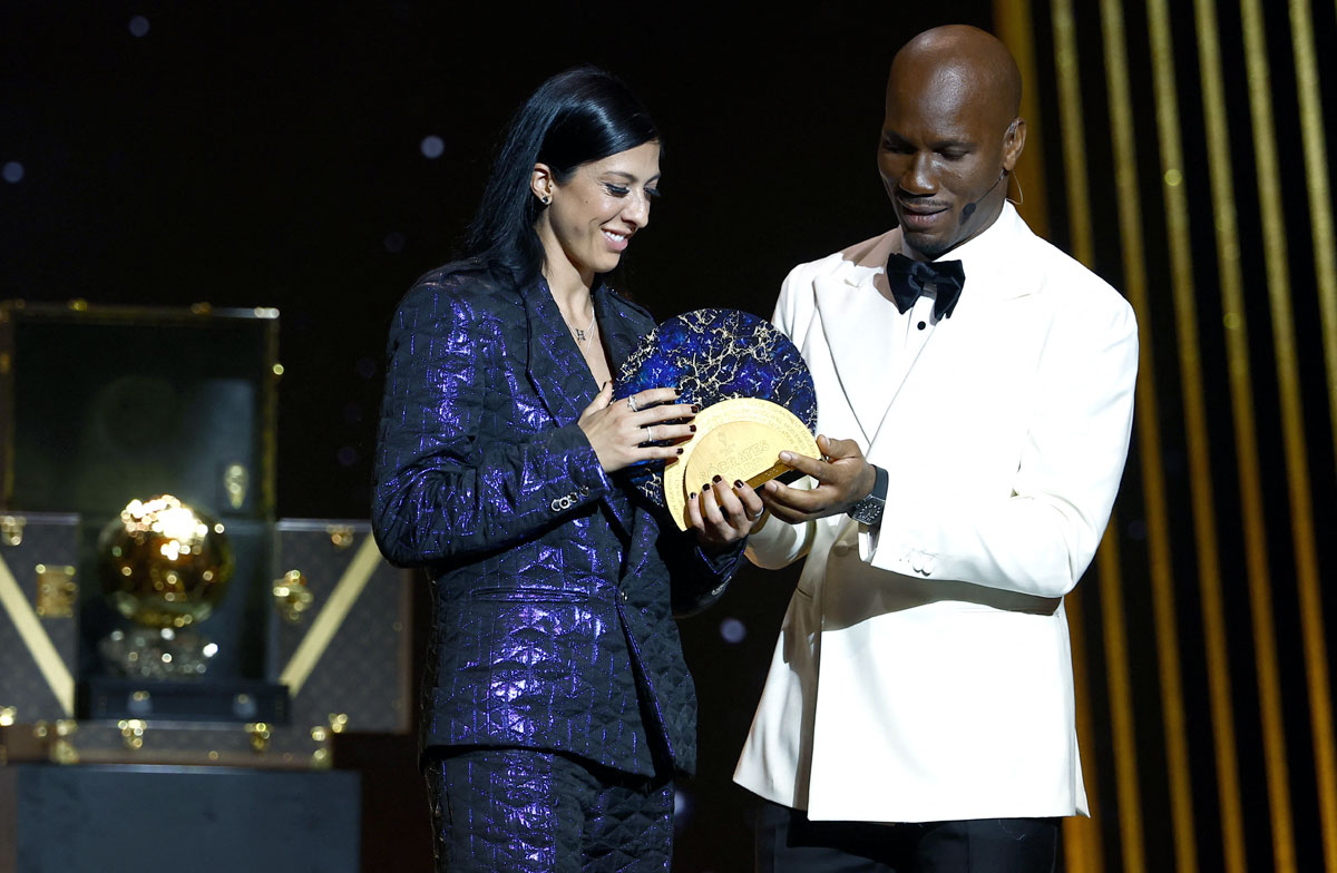 Spain's and Tigres UANL Jennifer Hermoso receives the Socrates Trophy from Didier Drogba