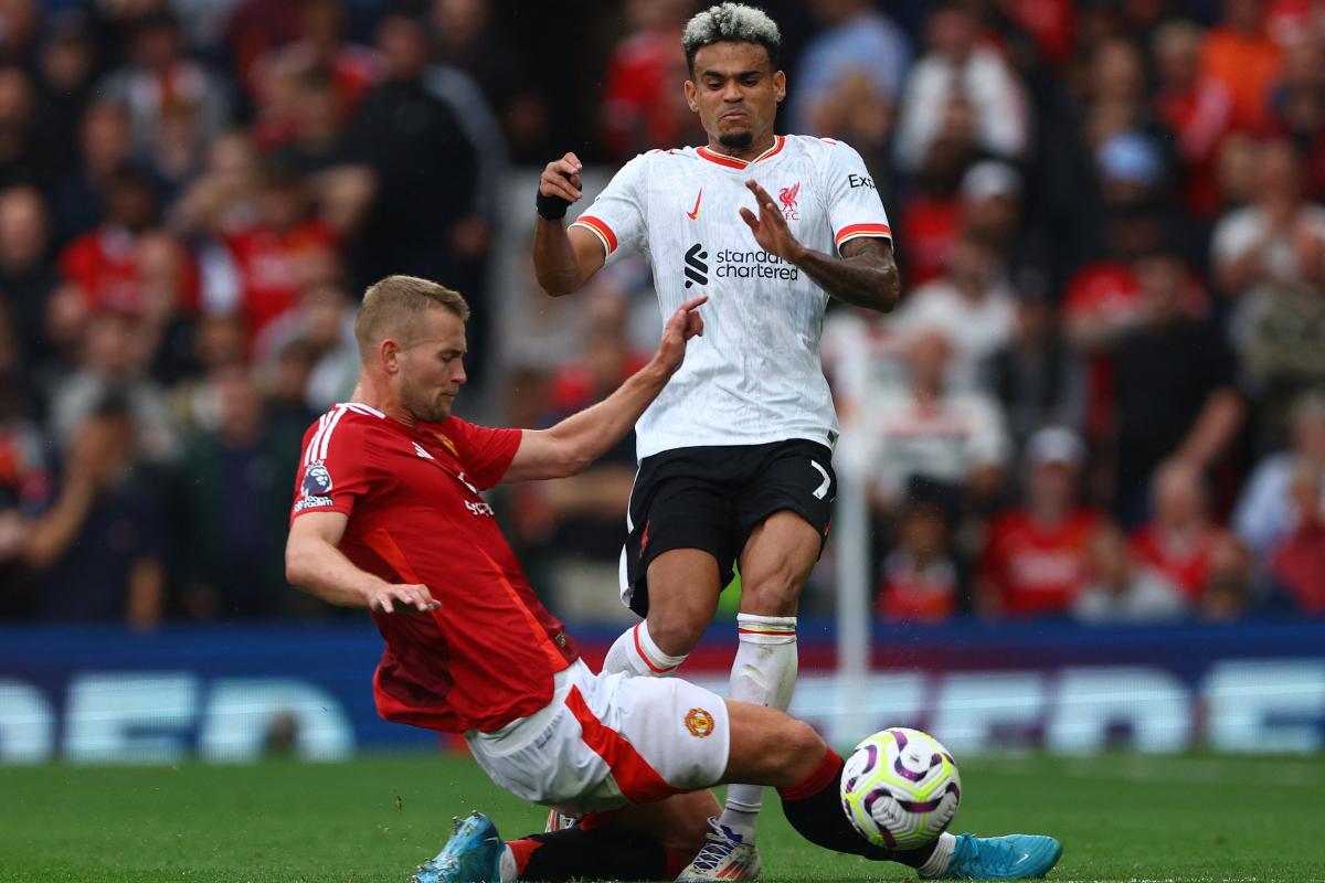 Liverpool's Luis Diaz vies for possession with Manchester United's Matthijs de Ligt