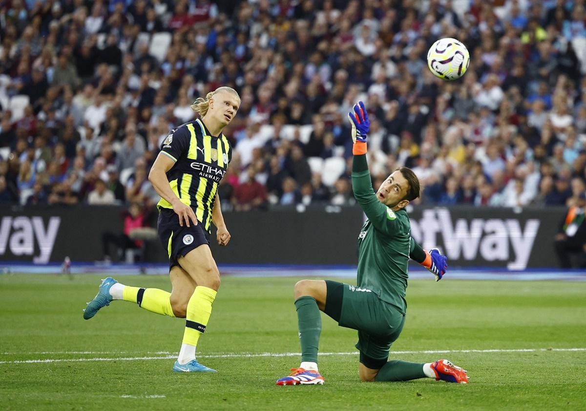 Erling Haaland scores Manchester City's third goal to complete his hat-trick.