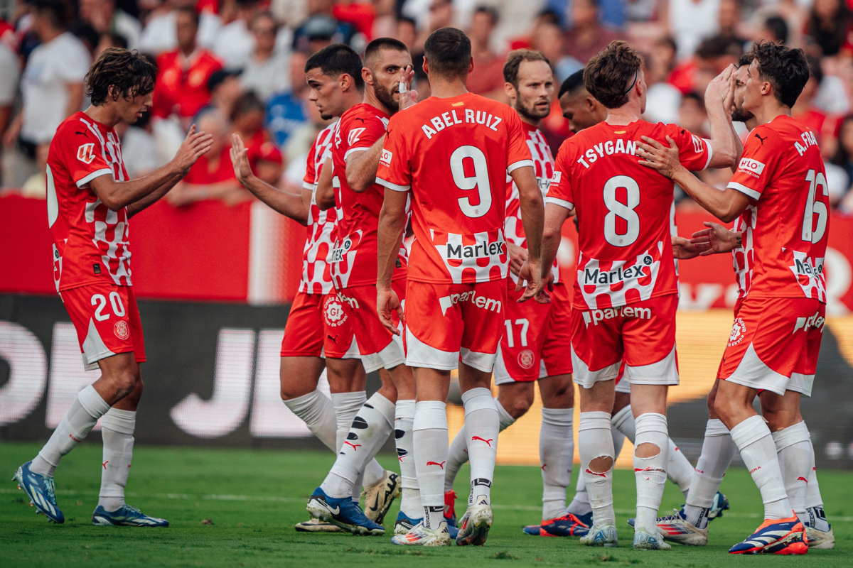 Girona FC players celebrate after their win over Sevilla on Sunday