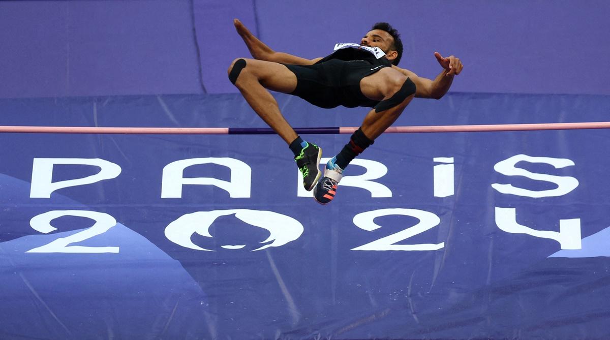 India's Nishad Kumar goes over the bar in the Paralympics men's High Jump T47 final at  Stade de France on Sunday.