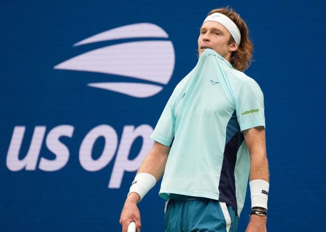 Andrey Rublev reacts after sending the ball narrowly outside the line.