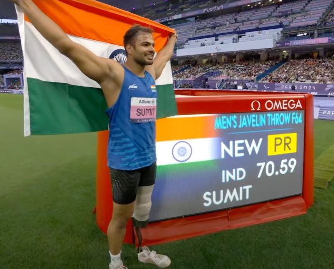 Sumit Antil celebrates with the tricolour after his record gold medal-winning throw. 