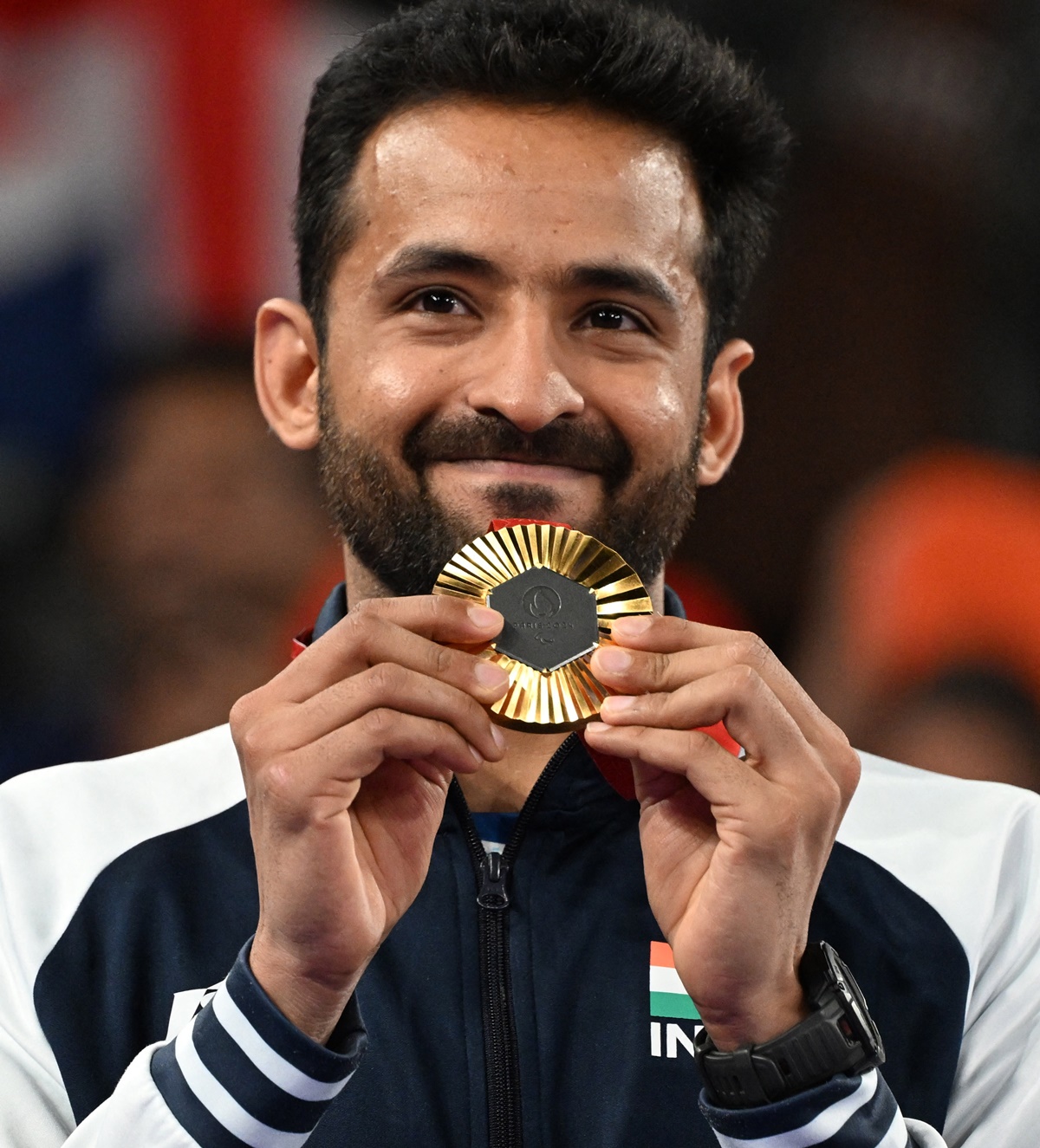 India's Nitesh Kumar proudly displays his gold medal from the men's badminton at the Paris Parylympics on Monday.