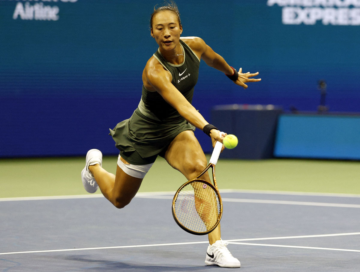 Qinwen Zheng reaches for a forehand against Donna Vekic