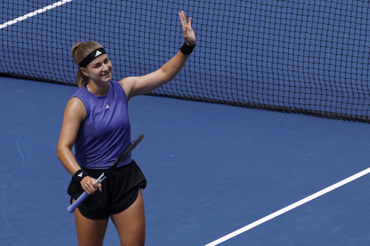 Karolina Muchova of the Czech Republic celebrates winning her match against Italy's Jasmine Piolini.