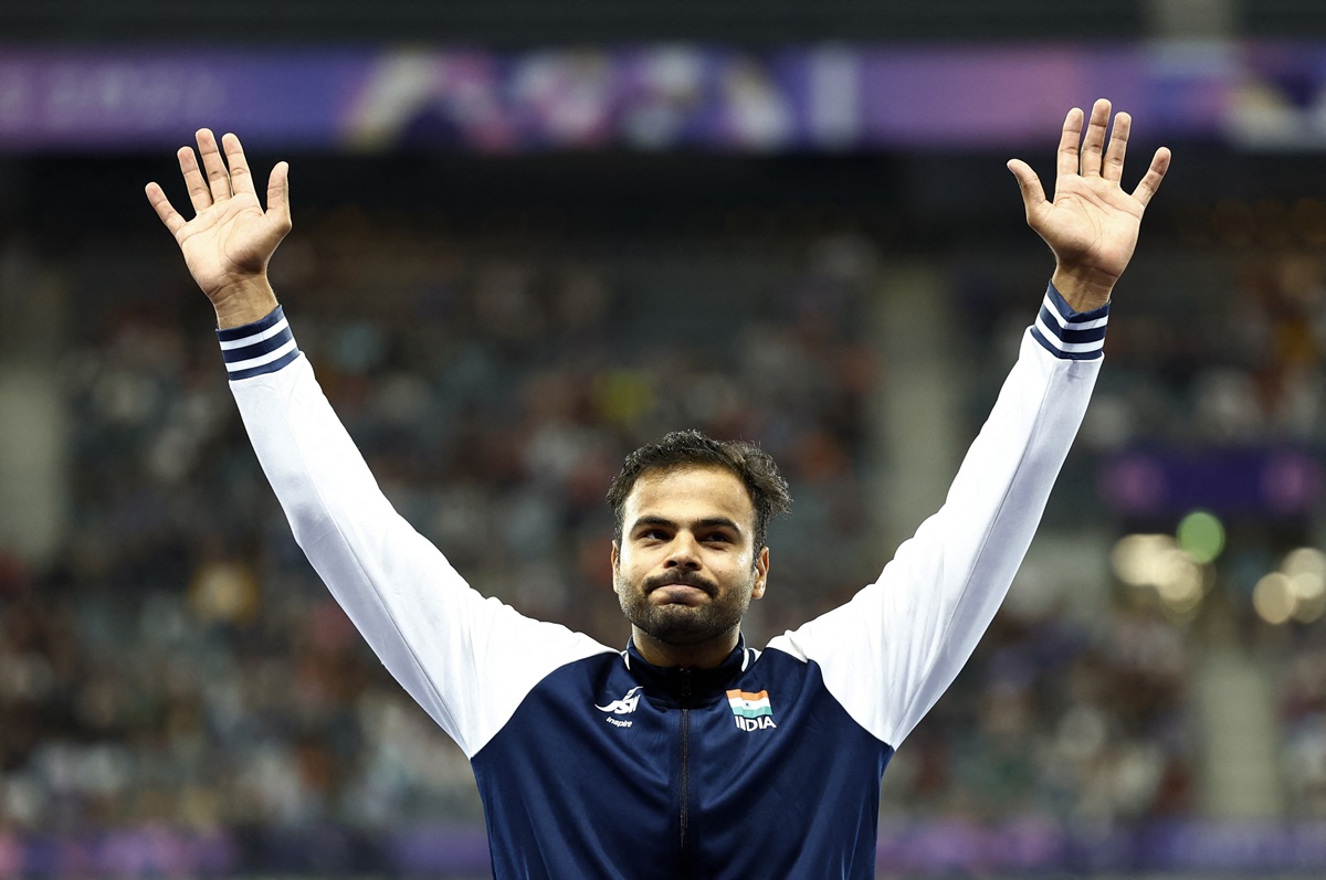 India's Sumit Antil waves to the stands as he steps on the podium after winning gold in the men's Javelin Throw at the Paris Paralympics on Monday.