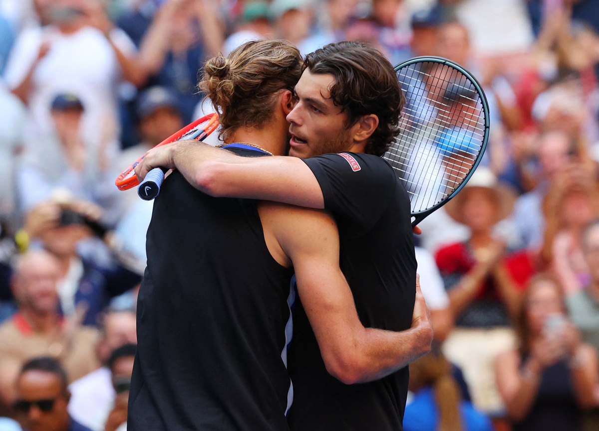 Taylor Fritz and Alexander Zverev embrace after the match.