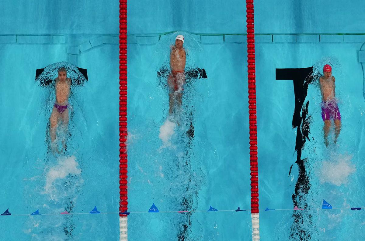 Yuan Weiyi of China, Guo Jincheng of China and Wang Lichao of China in action during the men's 50m backstroke S5 final