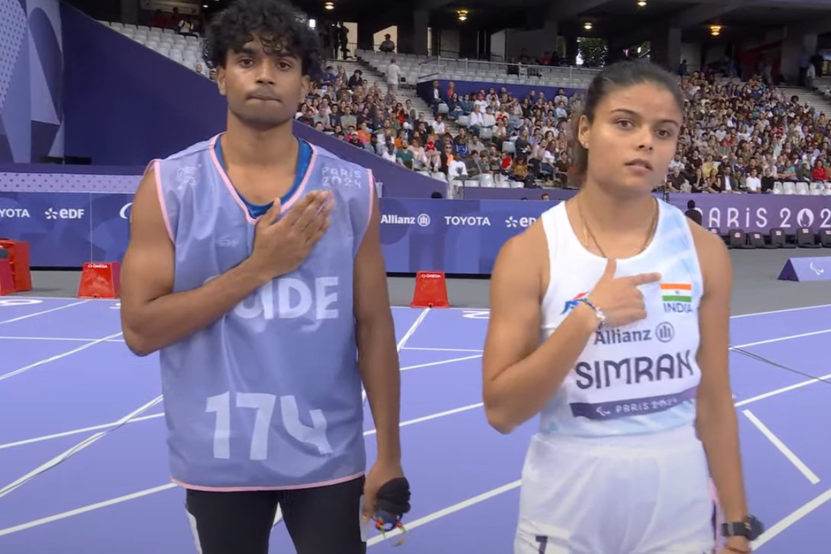 Simran with her guide Abhay Singh after their semi-final race at the Paralympic Games in Paris, on Thursday