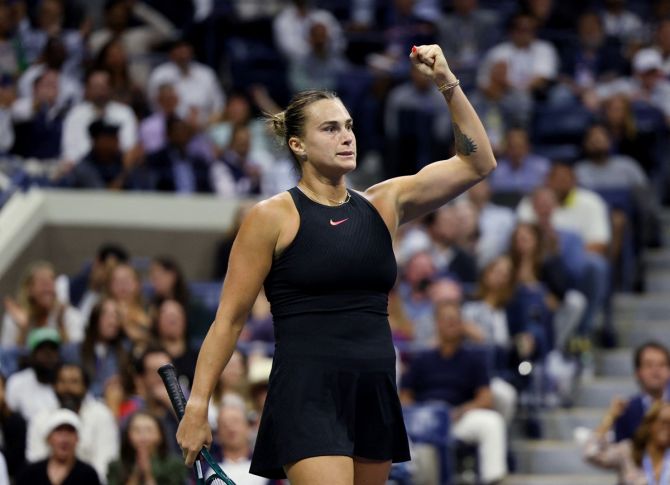 Aryna Sabalenka celebrates winning the first set against Emma Navarro