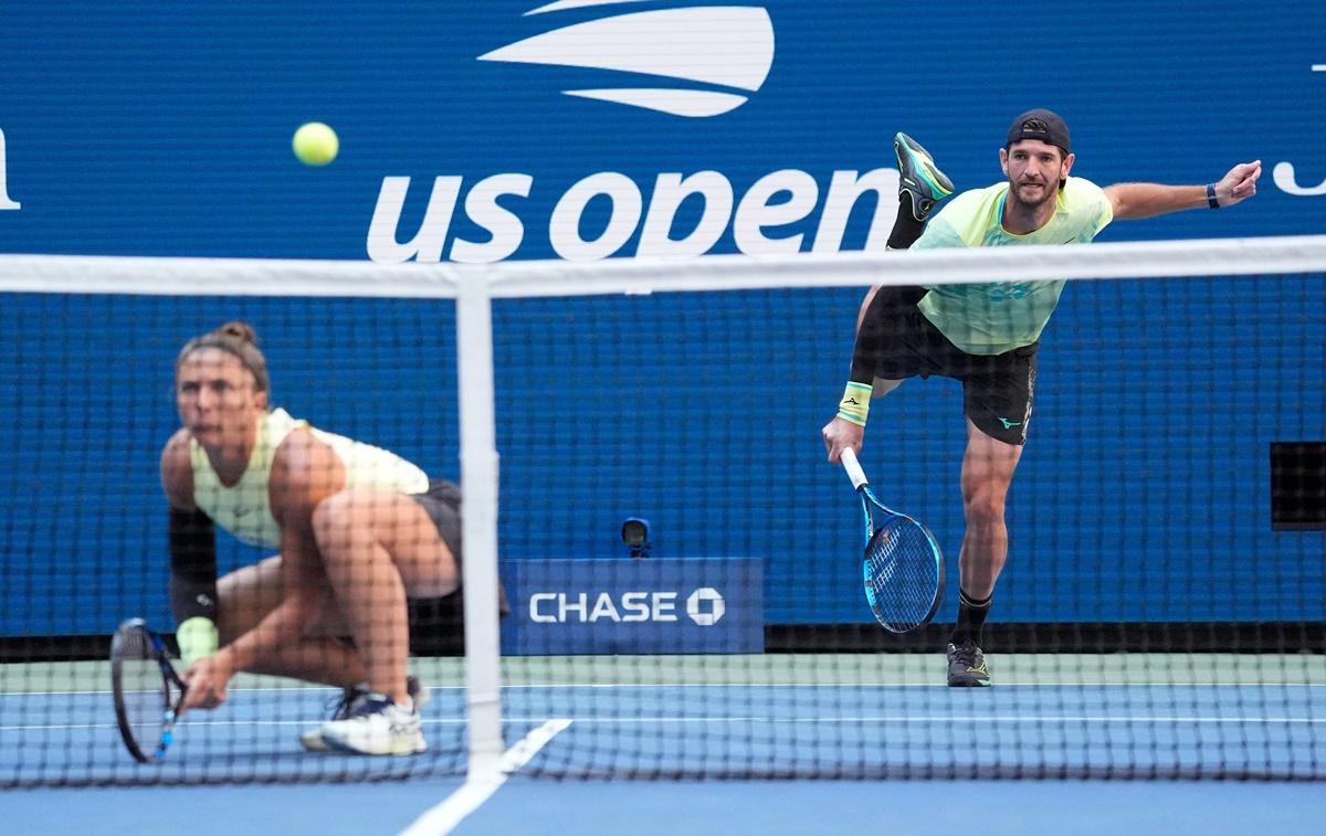 Sara Errani watches as Andrea Vavassori serves during the US Open mixed doubles final.