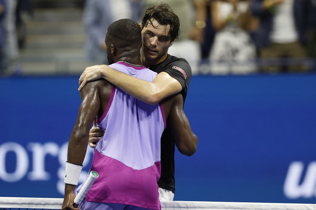 Taylor Fritz hugs Frances Tiafoe after the match.