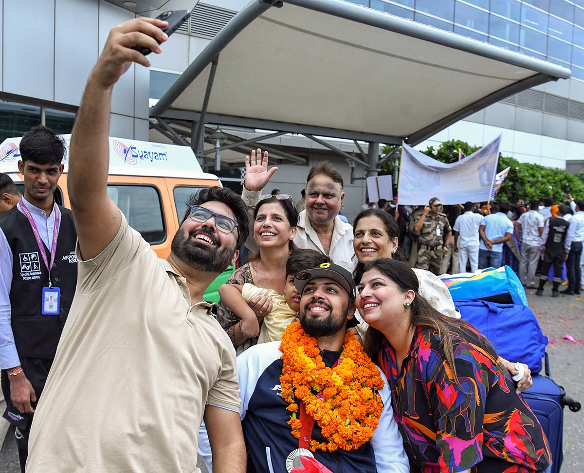 Paris Paralympics Silver Medalist Pranav Soorma receives a warm welcome on his return to the country, at IGI Airport in New Delhi on Saturday