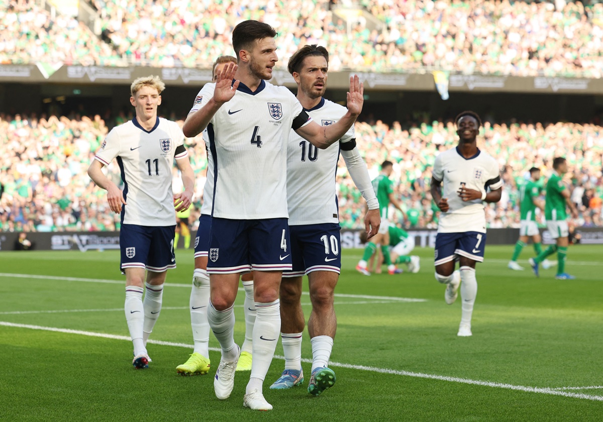 Declan Rice celebrates scoring England's first goal with Jack Grealish and Anthony Gordon 