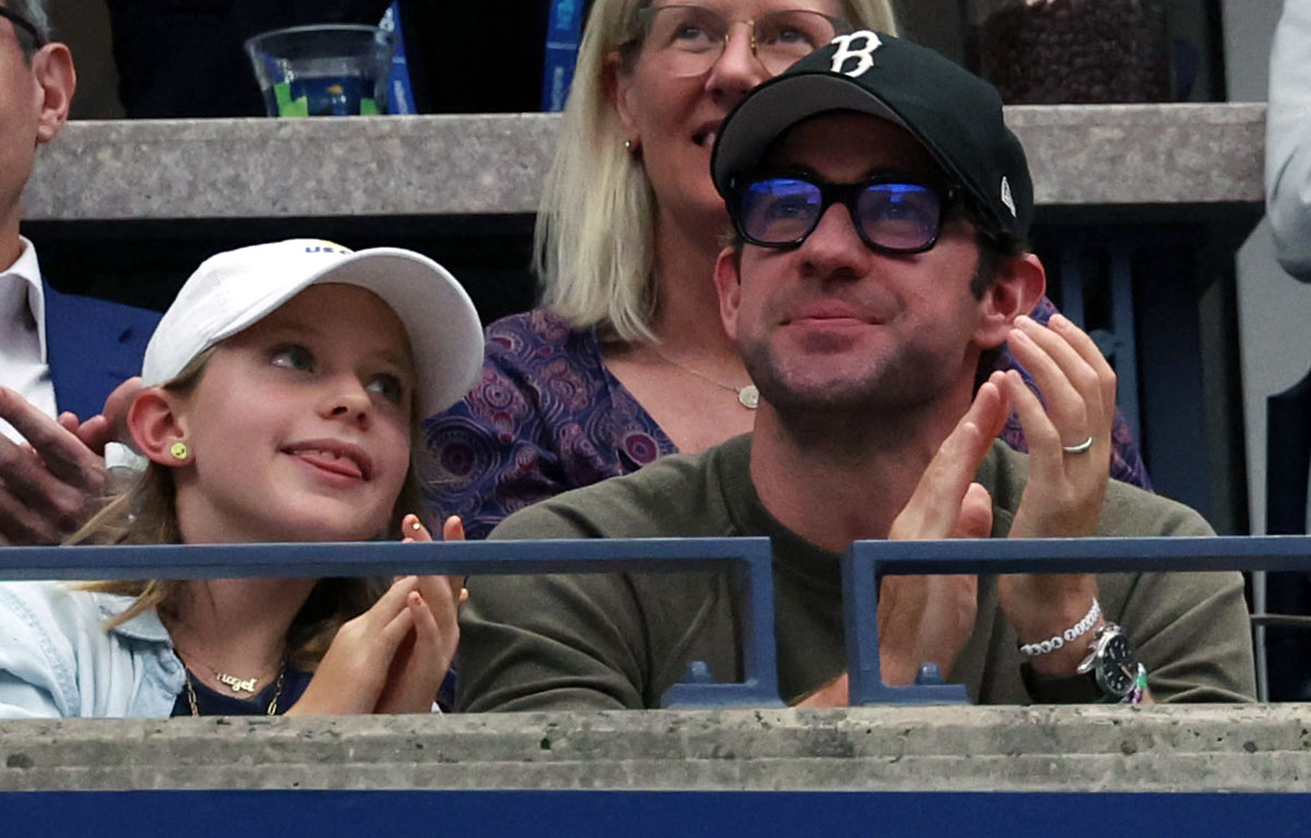 Actor John Krasinski and daughter in the stands