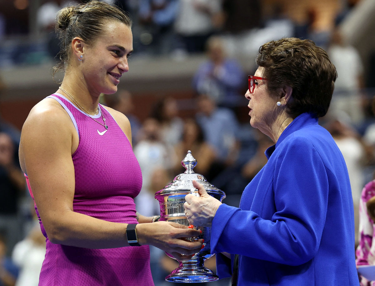 Aryna Sabalenka receives her trophy from tennis legend Billie Jean King