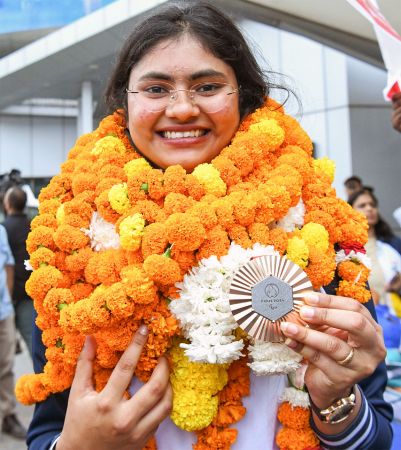 Rubina Francis poses with her bronze medal on her return to India on Saturday