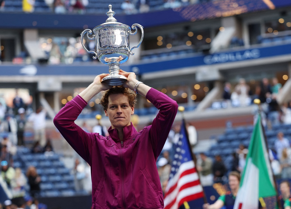 Italy's Jannik Sinner celebrates with the trophy after winning the US Open men's singles final against Taylor Fritz of the United States, at Flushing Meadows, New York, on Sunday.