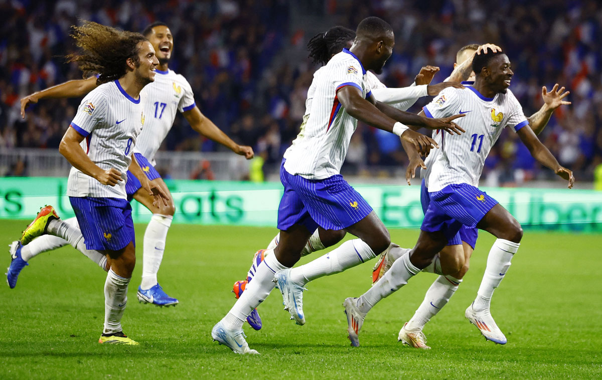 France's Ousmane Dembele celebrates scoring their second goal with teammates