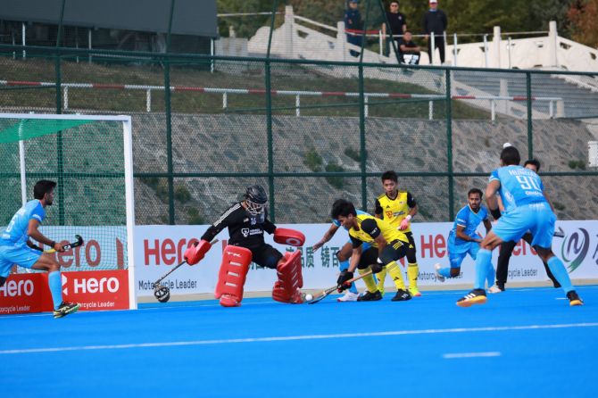 Action from the match between India and Malaysia 