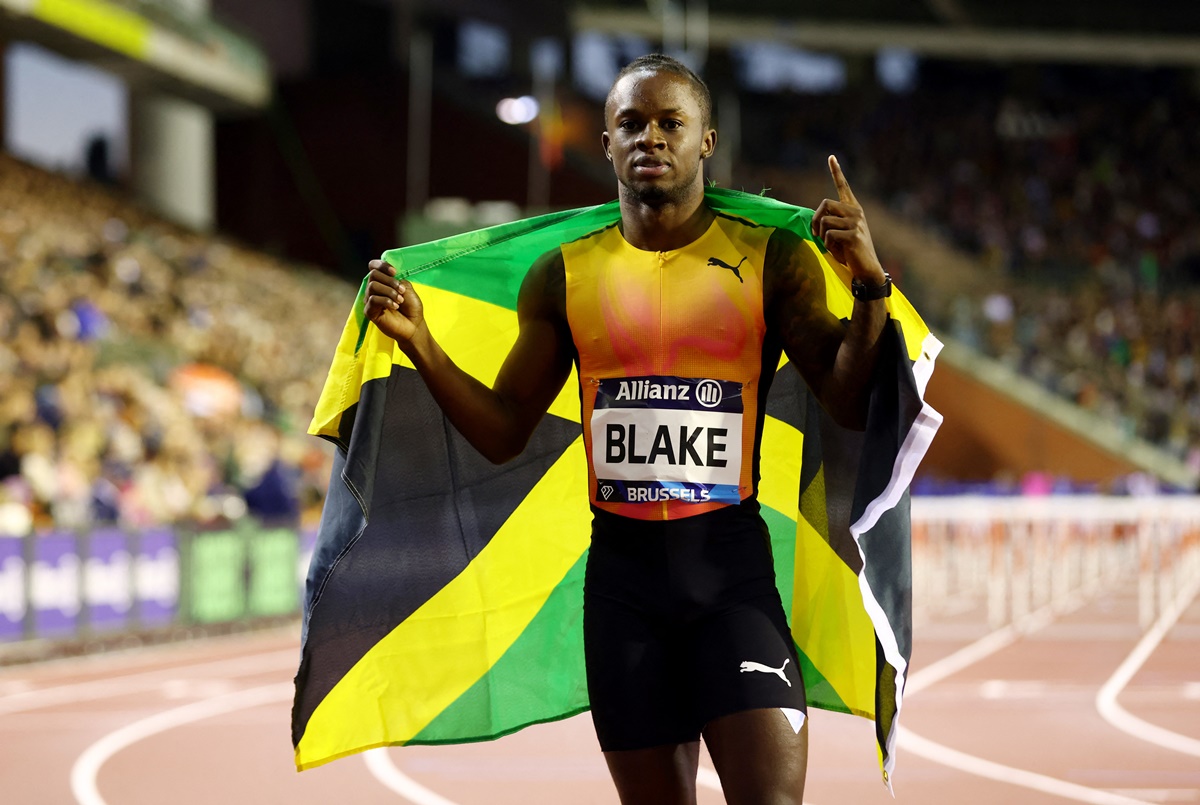 Jamaica's Ackeem Blake celebrates after winning the men's 100 metres.